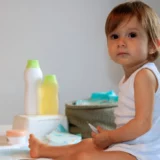 Baby Wearing White Clothes with Infant Shudder Syndrome