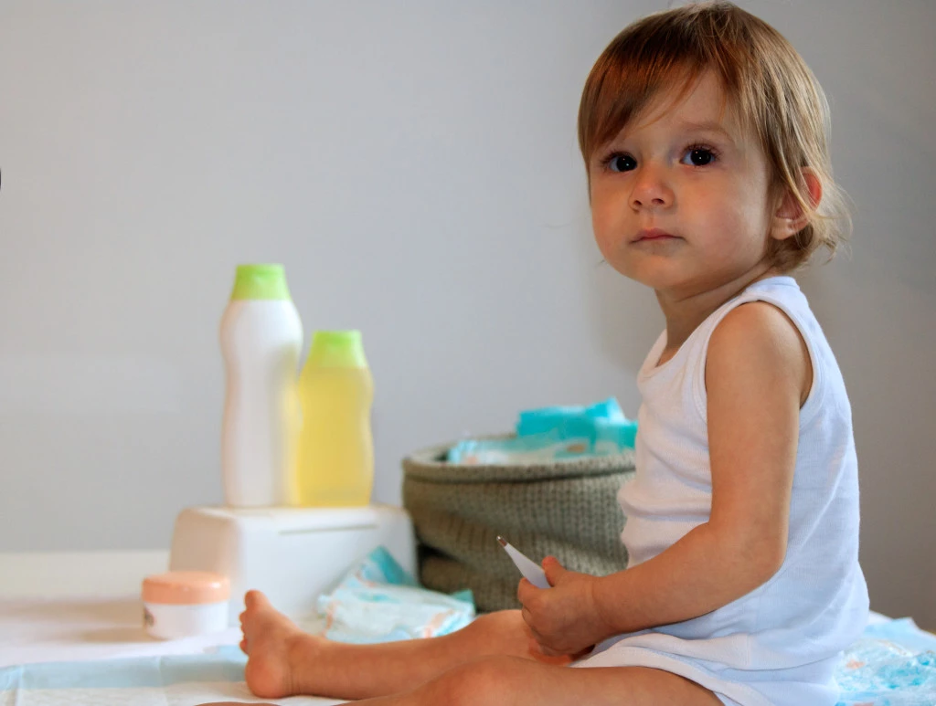 Baby Wearing White Clothes with Infant Shudder Syndrome