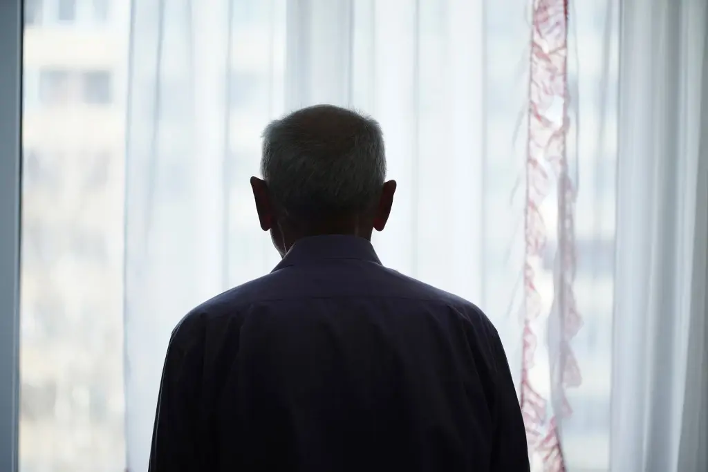 Nursing Home Abuse in Delaware: Old Man Looking Outside a Window