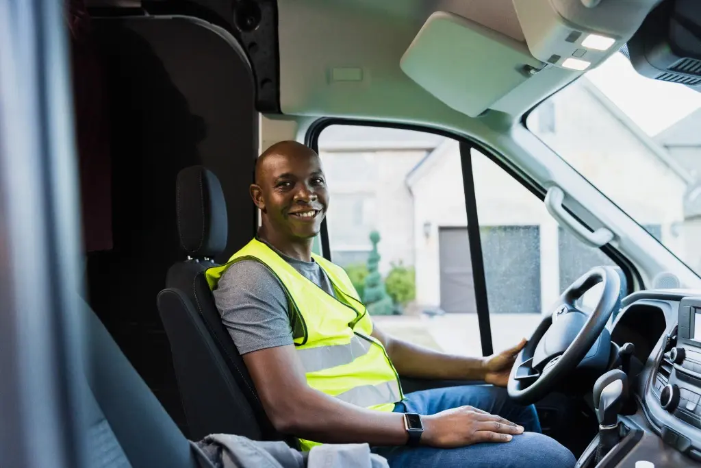 A man driving a van, performing job duties under the course and scope of employment in his job.