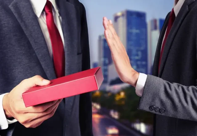 A man receiving an unwanted sexual gift from work.