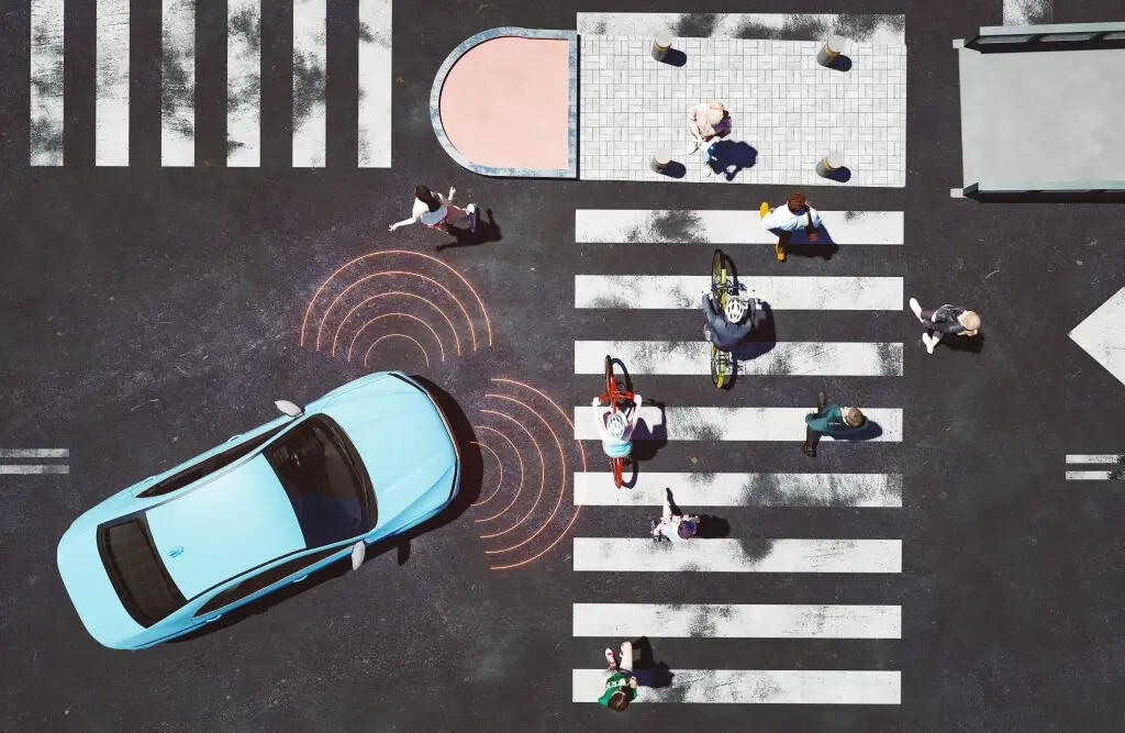 An automatic car sensing pedestrians in a crosswalk, preventing a self-driving car accident.