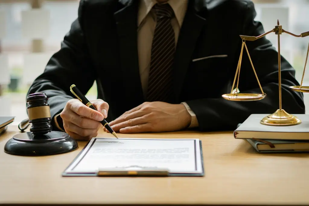 A lawyer sitting on a desk, outlining permanent partial disability benefits.