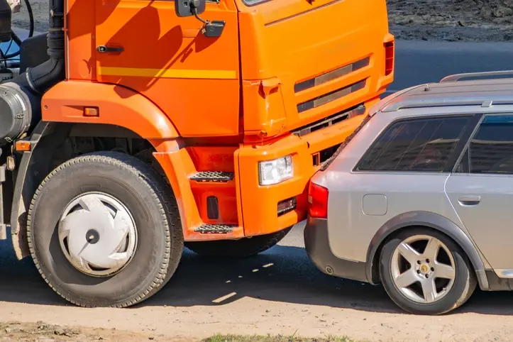 tailgating-accident A truck colliding with a vehicle's rear, causing a tailgating accident.