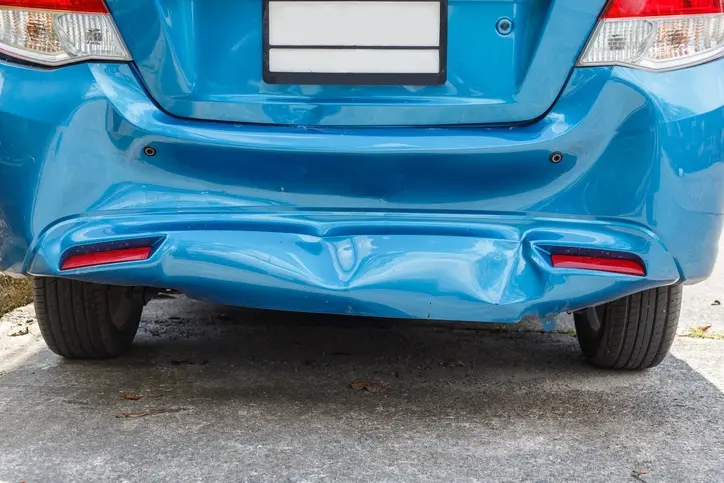 Damaged bumper from a rear-end accident.