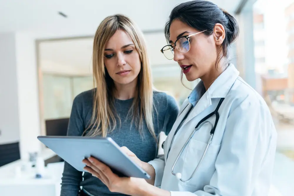 A doctor measuring maximum medical improvement for their patient.